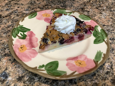 Clafoutis slice with whipped cream