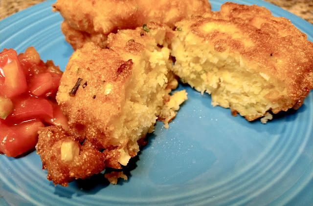 Corn fritters and salsa on a blue plate