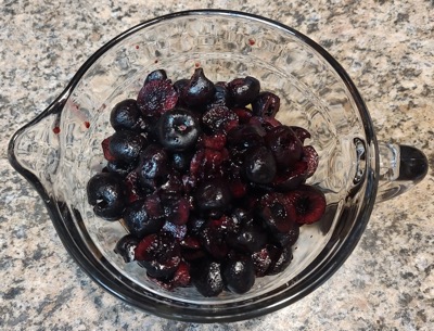 Fruit for cobbler in a glass measuring cup