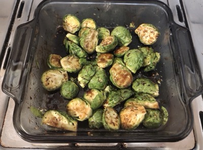 Cooked Brussels sprouts in a glass dish