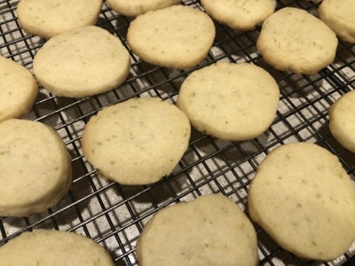 Baked cookies on a black cooling rack