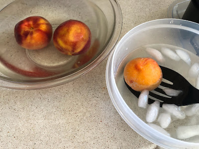 Peaches in two bowls of water