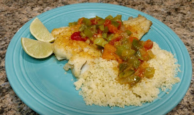 Pescado Veracruz with couscous on plate