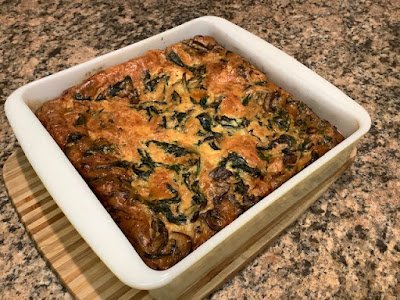 Quiche in a square white ceramic dish