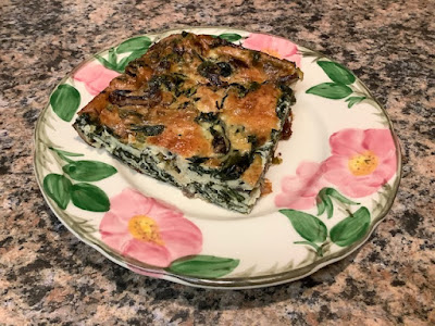Slice of quiche on a flowered plate