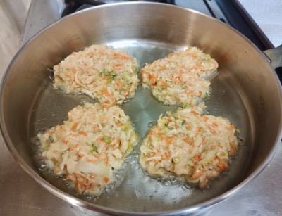 Fritters cooking in pan