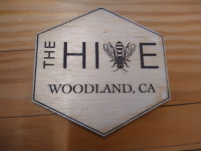 The Hive logo on a sign