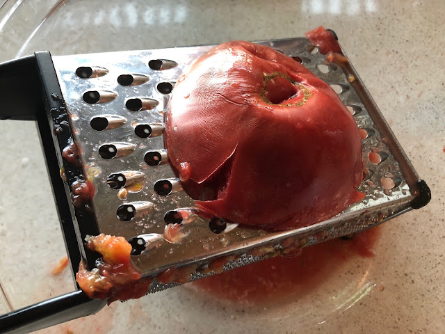 tomato half on a grater