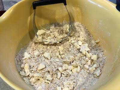 Butter and flour and oats in a yellow bowl