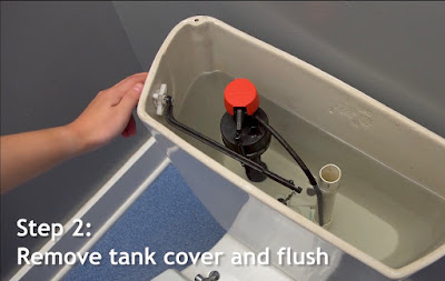 Toilet tank with lid removed