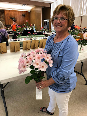 Smiling woman holding roses