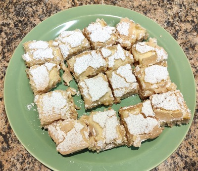 16 lemon bars on a plate