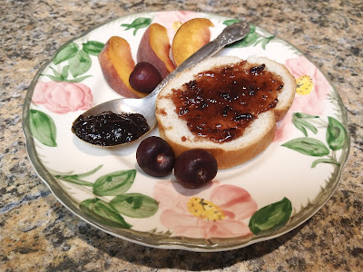 Conserve on toast on plate with fruit slices