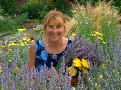 Woman in field of flowering plants