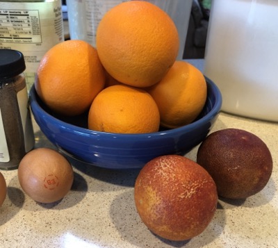 Oranges in a bowl and blood oranges on counter