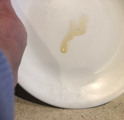 white plate with blob of sugary liquid
