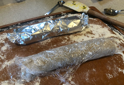 Dough logs wrapped in plastic and foil