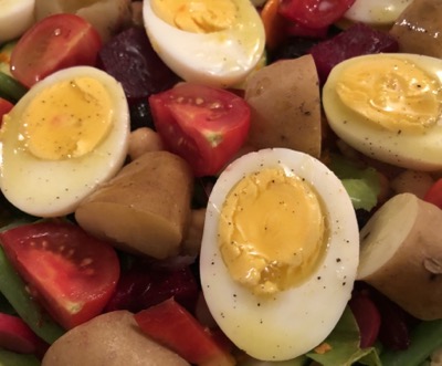 Detail image of salad with egg halves and vegetables