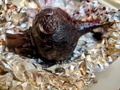 A roasted beet on foil