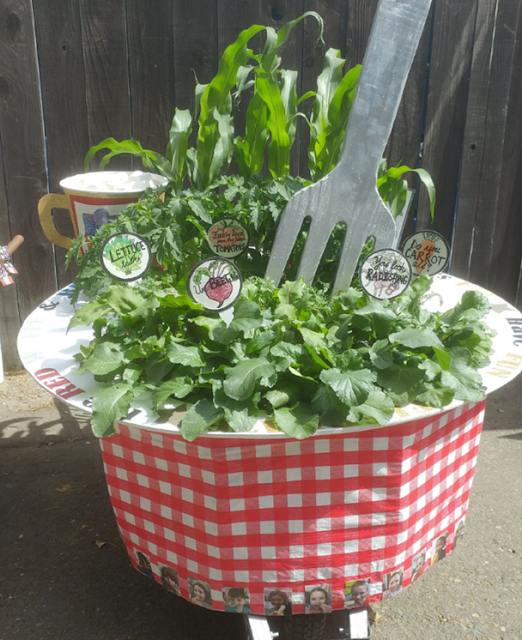 Wheelbarrow garden with large faux fork