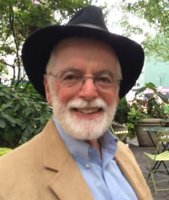 Smiling bearded man in hat