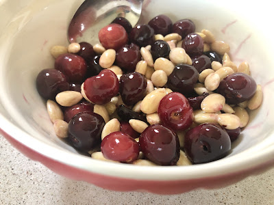 Cherries and almonds in bowl