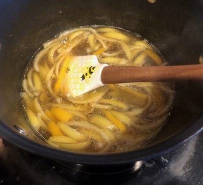 Lime and lemon slices in a pot of water