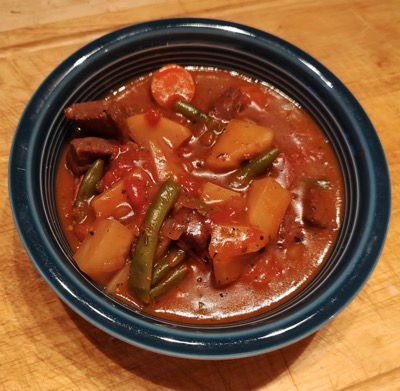 Stew in dark blue bowl