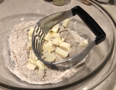Flour and sugar and butter in a bowl