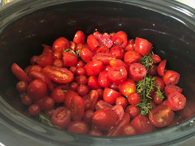 Tomatoes and herbs in slow cooker