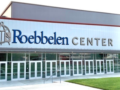 Large plain building with Roebbelen in blue letters