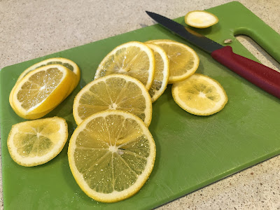 Lemon slices on a green board