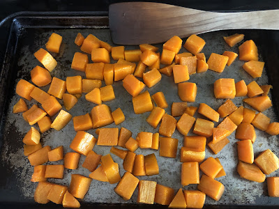 Butternut squash cubes on pan