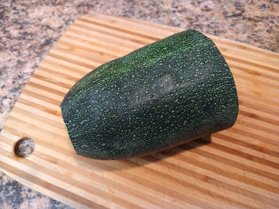 Chunk of zucchini on a cutting board