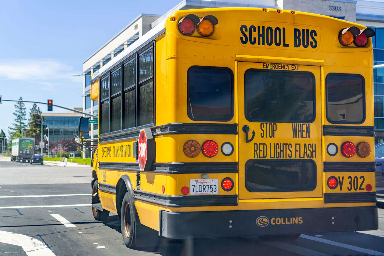 School bus stopped at a red light