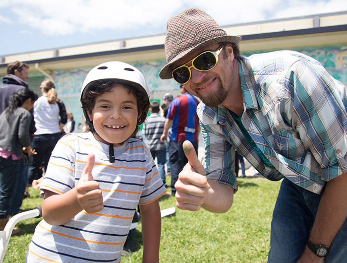 Young boy and man at an Ecology Action event