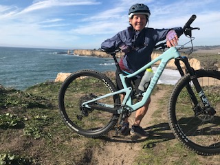 Woman with bike in nature